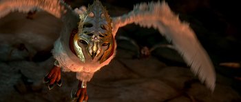 Movie still from “Legend of the Guardians: The Owls of Ga'Hoole” (2010), directed by Zack Snyder – A person wearing a mask and holding something in their hand; Close Up shot, Low angle
