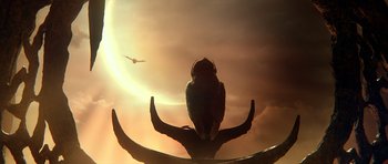 Movie still from “Legend of the Guardians: The Owls of Ga'Hoole” (2010), directed by Zack Snyder – A bird sitting on top of an antler in front of a cloudy sky; Extreme Wide shot, Low angle
