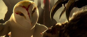 Movie still from “Legend of the Guardians: The Owls of Ga'Hoole” (2010), directed by Zack Snyder – An owl and an animal face each other in the dark; Extreme Close Up shot, Low angle