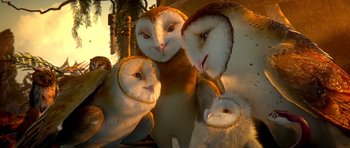 Movie still from “Legend of the Guardians: The Owls of Ga'Hoole” (2010), directed by Zack Snyder – A group of owls sitting next to each other on the ground; Close Up shot, Low angle