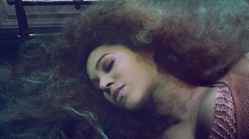 Movie still from “Lemonade” (2016), directed by Mark Romanek – A person laying on their stomach; Close Up shot, Overhead angle