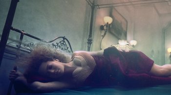 Movie still from “Lemonade” (2016), directed by Mark Romanek – A woman laying on a bed in a room; Medium shot, Overhead angle