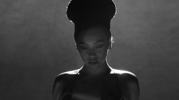 Movie still from “Lemonade” (2016), directed by Mark Romanek – A black and white photo of a woman with a hat on her head; Close Up shot, Low angle