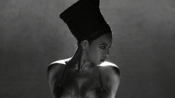 Movie still from “Lemonade” (2016), directed by Mark Romanek – A black and white photo of a woman with a hat on her head; Close Up shot, Low angle