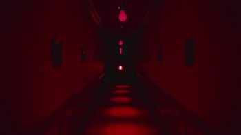 Movie still from “Lemonade” (2016), directed by Mark Romanek – A dark hallway with red lights and a light in the center; Extreme Wide shot, Low angle