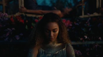 Movie still from “Lemonade” (2016), directed by Mark Romanek – A young woman with curly hair wearing a silver dress; Close Up shot, High angle