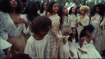 Movie still from “Lemonade” (2016), directed by Mark Romanek – A group of young women in white dresses; Wide shot, High angle