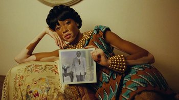 Movie still from “Lemonade” (2016), directed by Mark Romanek – A woman holding up a picture of a man; Close Up shot, Low angle