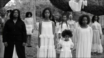 Movie still from “Lemonade” (2016), directed by Mark Romanek – A black and white photo of a group of young girls; Wide shot, High angle