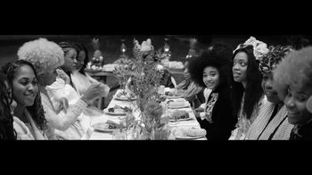 Movie still from “Lemonade” (2016), directed by Mark Romanek – A group of people sitting around a table; Medium shot, Over the shoulder angle