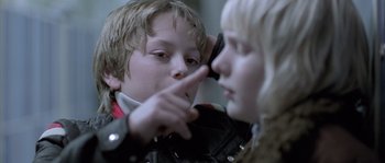 Movie still from “Let the Right One In” (2008), directed by Tomas Alfredson – A boy and a girl looking at each other; Close Up shot, Over the shoulder angle