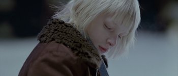 Movie still from “Let the Right One In” (2008), directed by Tomas Alfredson – A person wearing a jacket; Close Up shot, Low angle