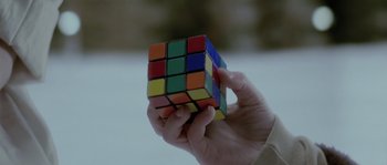 Movie still from “Let the Right One In” (2008), directed by Tomas Alfredson – A person holding a rubiks cube in their hand; Extreme Close Up shot, Overhead angle