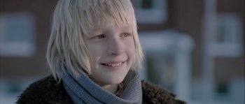 Movie still from “Let the Right One In” (2008), directed by Tomas Alfredson – A person wearing a scarf; Close Up shot, Low angle