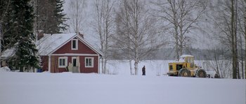 Movie still from “Let the Right One In” (2008), directed by Tomas Alfredson – A person standing in the snow near a red house; Extreme Wide shot, Low angle