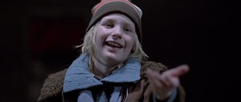 Movie still from “Let the Right One In” (2008), directed by Tomas Alfredson – A young girl wearing a hat and a jacket; Close Up shot, Low angle