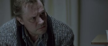 Movie still from “Let the Right One In” (2008), directed by Tomas Alfredson – A person wearing a sweater; Close Up shot, Over the shoulder angle