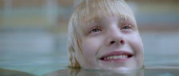Movie still from “Let the Right One In” (2008), directed by Tomas Alfredson – A person in a body of water; Extreme Close Up shot, Low angle