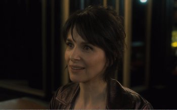 Movie still from “Let the Sunshine In” (2017), directed by Claire Denis – A person wearing a leather jacket; Close Up shot, Over the shoulder angle