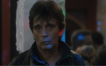 Movie still from “Let the Sunshine In” (2017), directed by Claire Denis – A person wearing a leather jacket; Close Up shot, Over the shoulder angle