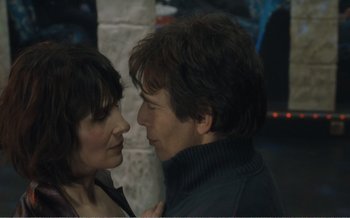 Movie still from “Let the Sunshine In” (2017), directed by Claire Denis – A man and a woman are looking into each others eyes; Close Up shot, Over the shoulder angle