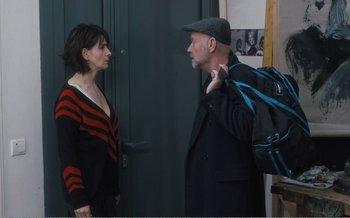 Movie still from “Let the Sunshine In” (2017), directed by Claire Denis – A man and a woman standing next to each other; Medium shot, Over the shoulder angle