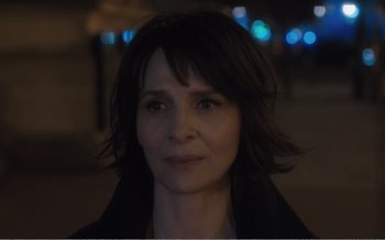 Movie still from “Let the Sunshine In” (2017), directed by Claire Denis – A person with short hair; Close Up shot, Over the shoulder angle