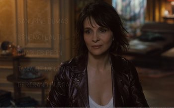 Movie still from “Let the Sunshine In” (2017), directed by Claire Denis – A person wearing a leather jacket; Close Up shot, High angle