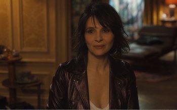 Movie still from “Let the Sunshine In” (2017), directed by Claire Denis – A person wearing a leather jacket; Close Up shot, Over the shoulder angle