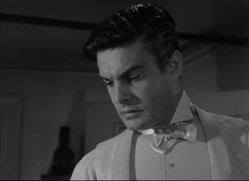 Movie still from “Letter from an Unknown Woman” (1948), directed by Max Ophüls – A black and white photo of a man in a bow tie; Close Up shot, Low angle