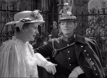 Movie still from “Letter from an Unknown Woman” (1948), directed by Max Ophüls – A man and a woman dressed in period clothing; Medium shot, Over the shoulder angle