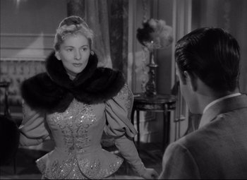 Movie still from “Letter from an Unknown Woman” (1948), directed by Max Ophüls – A black and white photo of a woman and a man; Medium shot, Over the shoulder angle