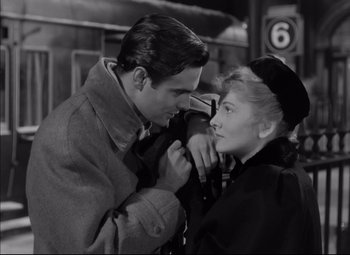 Movie still from “Letter from an Unknown Woman” (1948), directed by Max Ophüls – A man and a woman looking into each others eyes; Medium shot, Low angle