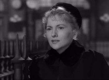 Movie still from “Letter from an Unknown Woman” (1948), directed by Max Ophüls – An old photo of a woman in a black coat and a hat; Close Up shot, Over the shoulder angle