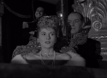 Movie still from “Letter from an Unknown Woman” (1948), directed by Max Ophüls – A man and a woman are sitting in front of a mirror; Medium shot, Low angle