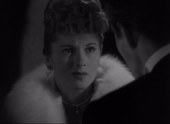 Movie still from “Letter from an Unknown Woman” (1948), directed by Max Ophüls – A black - and - white photo of a woman in a fur coat; Close Up shot, Over the shoulder angle