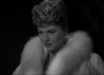 Movie still from “Letter from an Unknown Woman” (1948), directed by Max Ophüls – An old photo of a woman wearing a fur coat; Close Up shot, Low angle