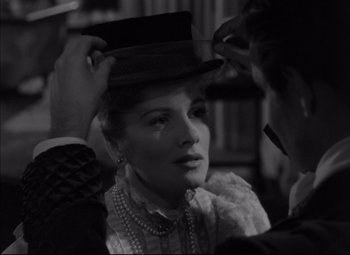 Movie still from “Letter from an Unknown Woman” (1948), directed by Max Ophüls – A man putting a hat on a woman's head; Close Up shot, Over the shoulder angle
