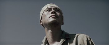 Movie still from “Letters from Iwo Jima” (2006), directed by Clint Eastwood – A person wearing a head covering; Close Up shot, Low angle