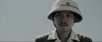 Movie still from “Letters from Iwo Jima” (2006), directed by Clint Eastwood – A man wearing a hat with a star on it; Close Up shot, Low angle
