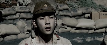 Movie still from “Letters from Iwo Jima” (2006), directed by Clint Eastwood – A young man wearing a hat and a jacket; Close Up shot, Low angle