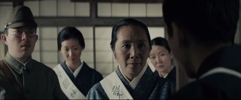 Movie still from “Letters from Iwo Jima” (2006), directed by Clint Eastwood – A group of women standing next to each other in front of a window; Close Up shot, Over the shoulder angle
