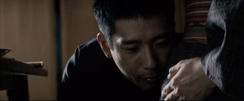 Movie still from “Letters from Iwo Jima” (2006), directed by Clint Eastwood – A person talking on a cell phone; Close Up shot, Low angle