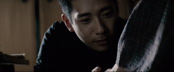 Movie still from “Letters from Iwo Jima” (2006), directed by Clint Eastwood – A person looking at the camera; Close Up shot, Over the shoulder angle