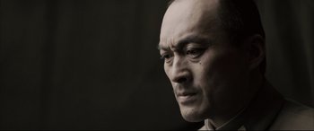 Movie still from “Letters from Iwo Jima” (2006), directed by Clint Eastwood – A man's face in black and white; Close Up shot, Low angle