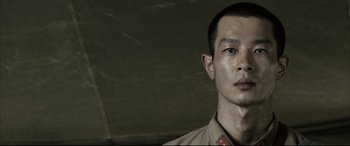 Movie still from “Letters from Iwo Jima” (2006), directed by Clint Eastwood – A person wearing a uniform; Close Up shot, Low angle