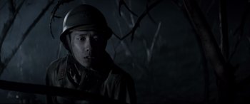 Movie still from “Letters from Iwo Jima” (2006), directed by Clint Eastwood – A man wearing a hat and a uniform; Close Up shot, Low angle