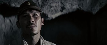 Movie still from “Letters from Iwo Jima” (2006), directed by Clint Eastwood – A person wearing a hat; Close Up shot, Low angle