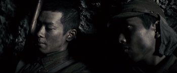 Movie still from “Letters from Iwo Jima” (2006), directed by Clint Eastwood – A person wearing a hat; Close Up shot, High angle