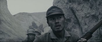 Movie still from “Letters from Iwo Jima” (2006), directed by Clint Eastwood – A group of men standing next to each other on top of a hill; Close Up shot, Low angle